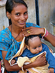 Rajasthani woman with baby in her lap
