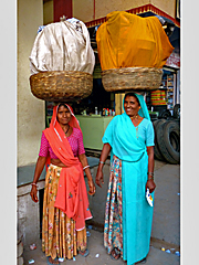 Two Rajasthani woman carrying head loads