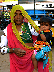 Rajasthani woman carrying child
