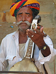 Rajasthani man playing string instument
